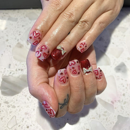 Valentine's Day Romance Long Square Press-On Nails in Red and White with Glitter Accents and Heart Designs