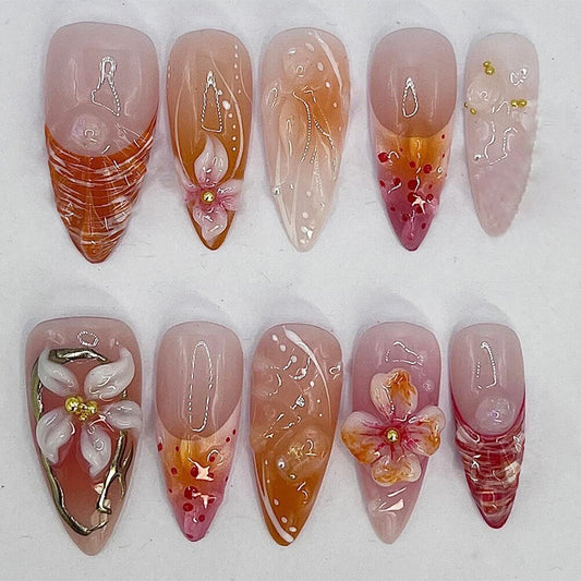 Floral Sunset Fantasy Long Almond Pink and Orange Press On Nail Set with Unique Flower Designs and Glitter Accents