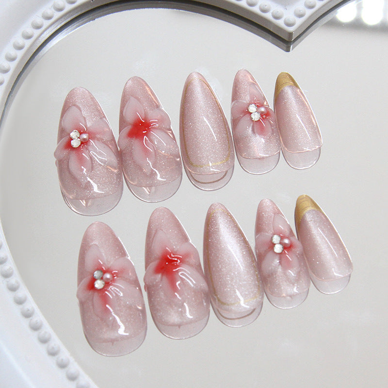 Blossom Elegance Medium Almond Pink Ombre Nails with Floral Accents and Shimmering Finish