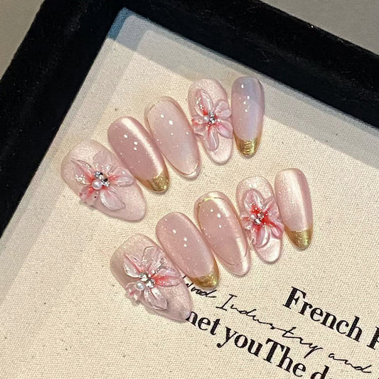 Blossom Bliss Medium Almond Pink Nail Set with Floral Accents and Gold Tips