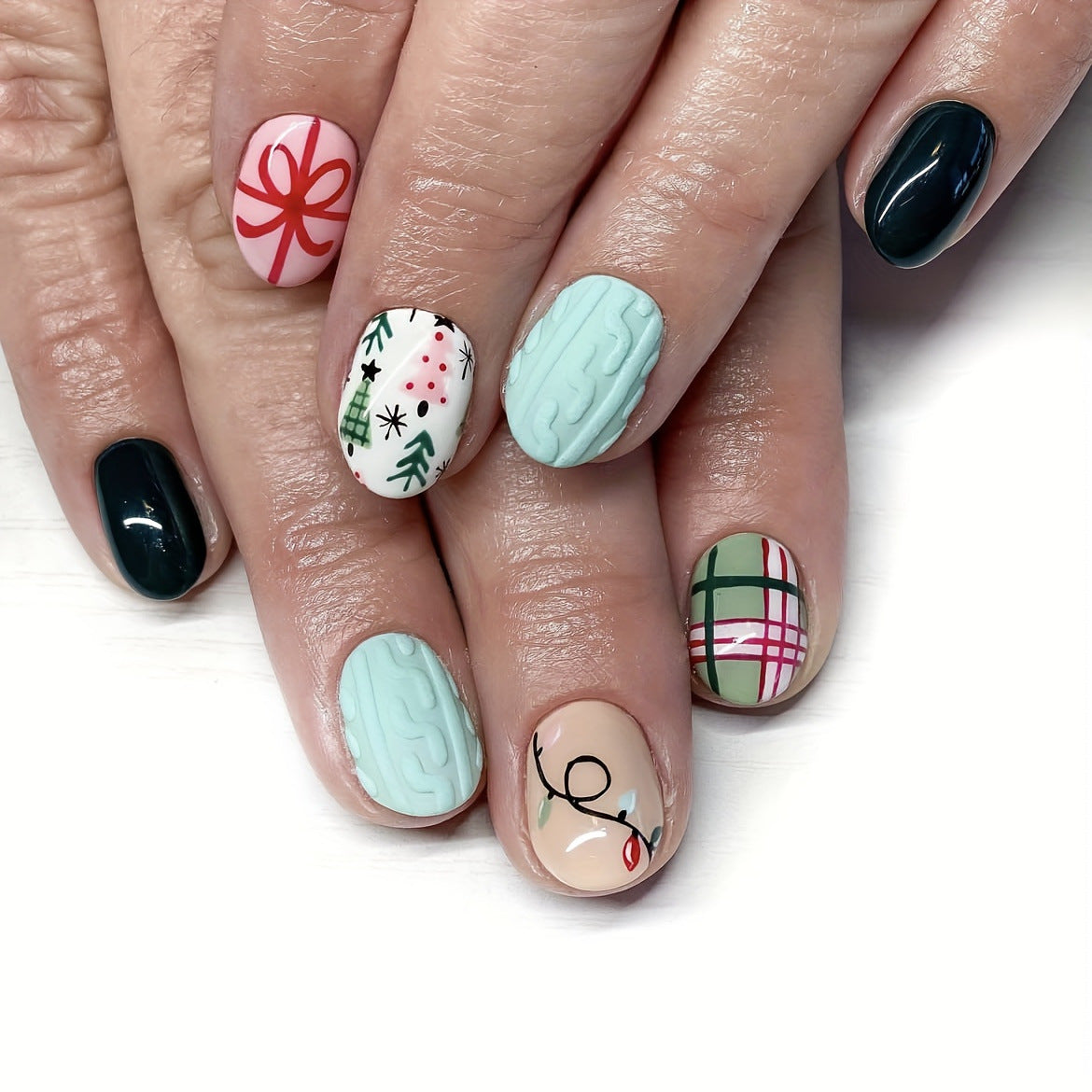 Winter Wonderland Short Length Round Press on Nail Set in Pastel Tones with Festive Holiday Designs