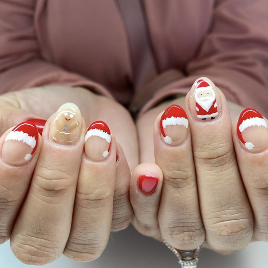 Santa's Workshop Medium Oval Red and Beige Press On Nail Set with Santa and Snow Caps Design