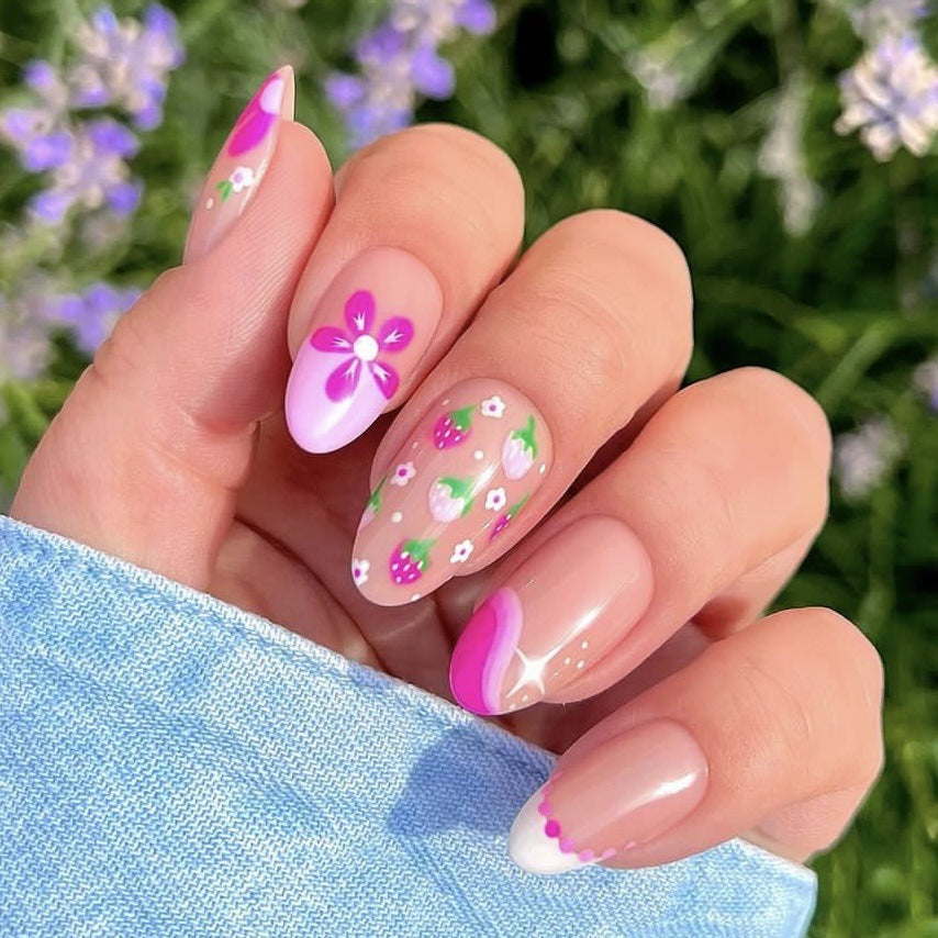 Spring Blossom Medium Almond Pastel Pink Press On Nail Set with Floral Accents and French Tip Design