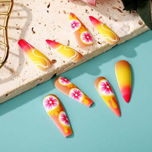 Tropical Sunset Long Almond Gradient Orange Yellow Press On Nails with Floral Accents