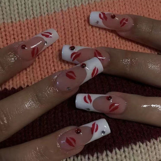 Cherry Blossom Long Coffin Press-On Nails with Sheer Pink Base, White Tips, and Red Floral Accents