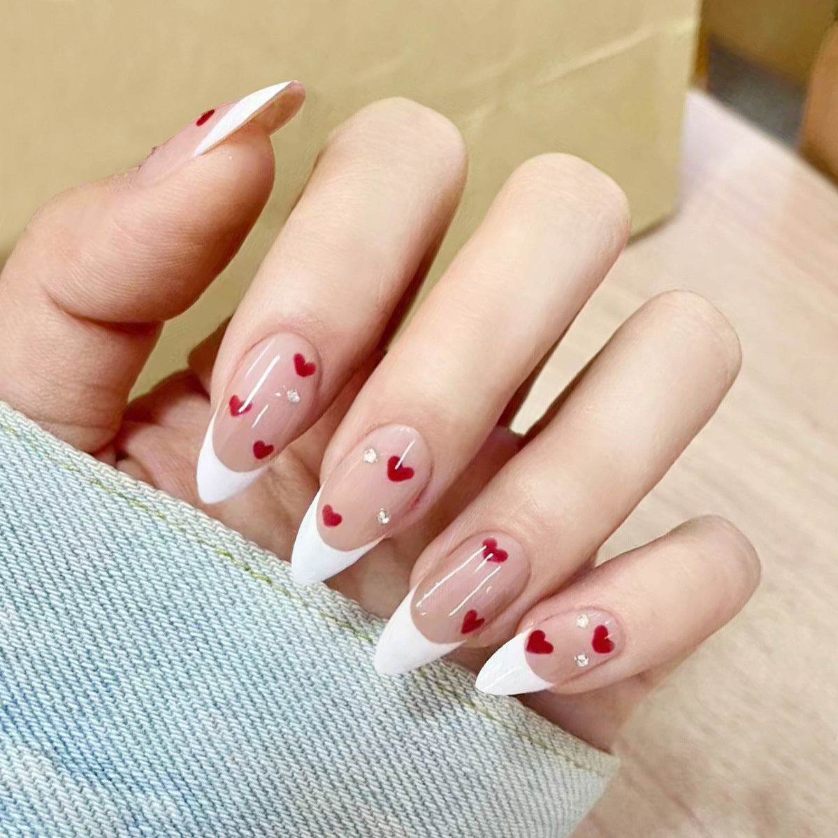 Romantic Affair Medium Almond White Press On Nails with Red Hearts and Rhinestone Accents