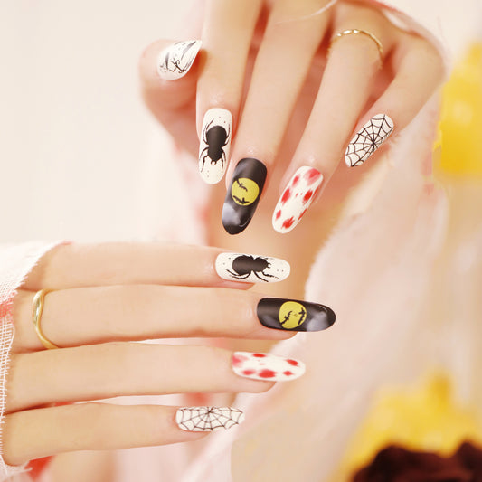 Enchanted Halloween Long Oval Black and White Press On Nail Set with Spooky Accents and Red Pops of Color