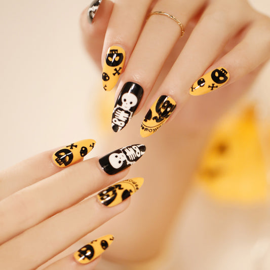 Spooky Elegance Medium Almond Black and Yellow Halloween-Themed Press On Nail Set with Skull and Pumpkin Accents