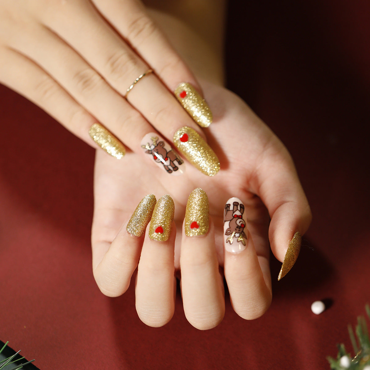 Holiday Sparkle Long Oval Gold Glitter Press On Nail Set with Festive Reindeer Accents