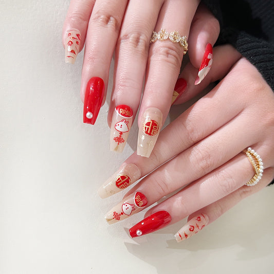 Lucky Charm Medium Coffin Red and Beige Press On Nail Set with Festive Asian-Inspired Design