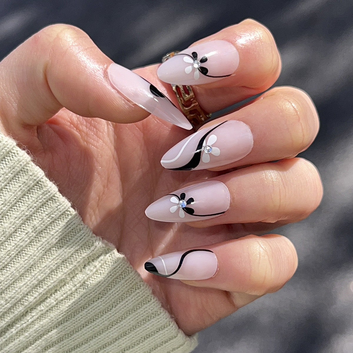 Floral Finesse Long Almond Beige Press-On Nail Set with Black French Tips and White Flower Accents