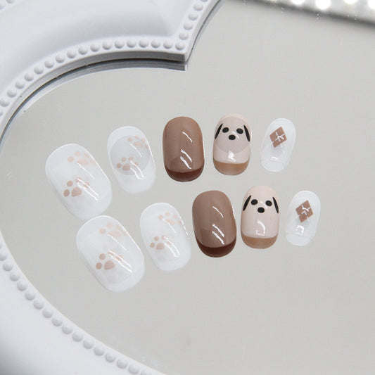 Puppy Love Medium Oval Natural Tone Press-On Nails with Paw Prints and Adorable Dog Face Artwork