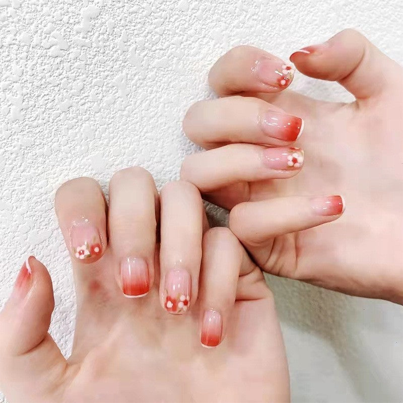 Cherry Blossom Short Squoval Natural Press-on Nail Set with Delicate Flower Art and Pink Accents