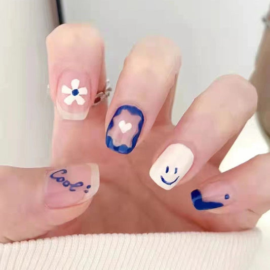 Cheerful Short Squoval Pastel Press-On Nail Set with Floral and Smiley Face Accents