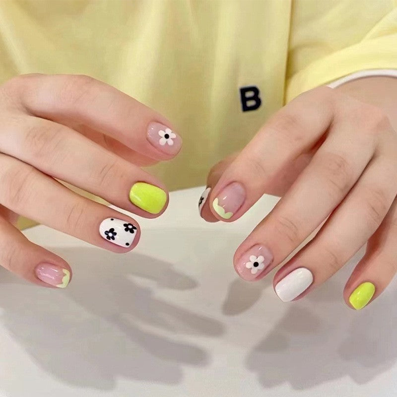 Spring Fling Short Round Press On Nails in Pastel Pink and Vibrant Yellow with Floral and Polka Dot Design