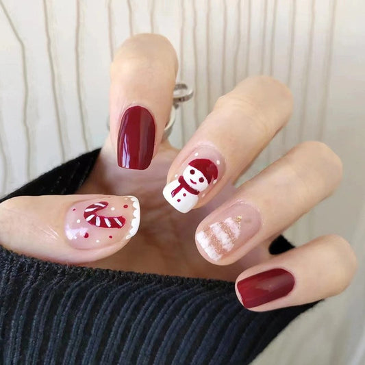 Winter Wonderland Medium Square Press On Nails in Rich Burgundy and Sheer Pink with Snowman and Candy Cane Accents