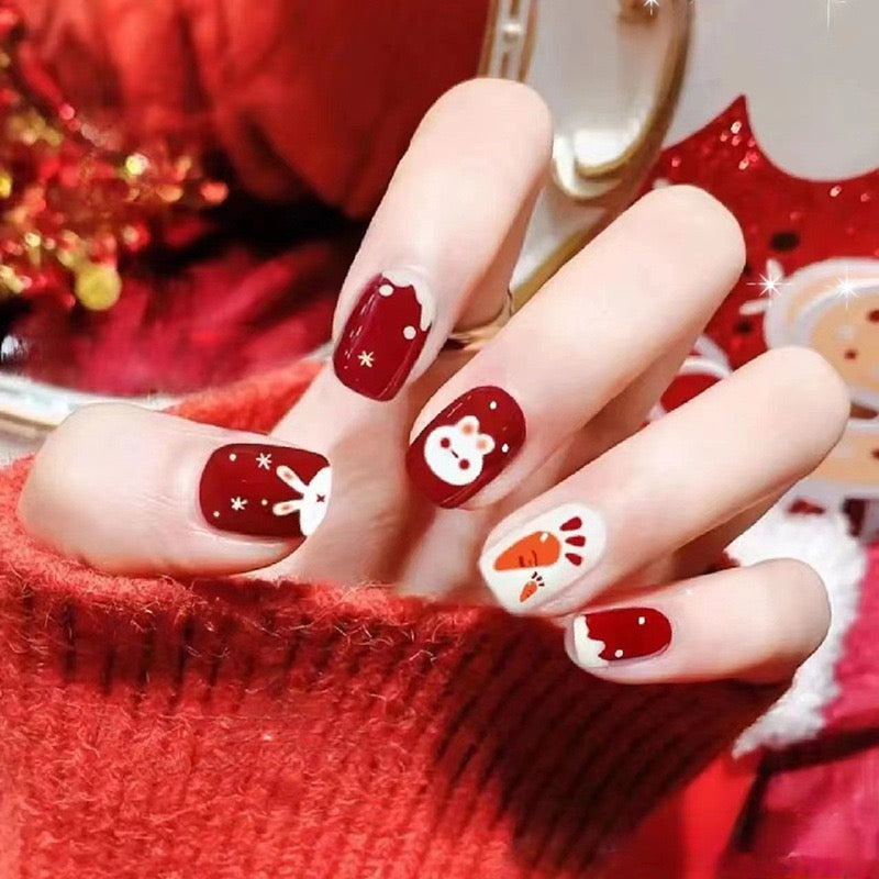 Festive Funtime Medium Square Press-On Nails in Classic Red and White with Bunny and Snowflake Accents