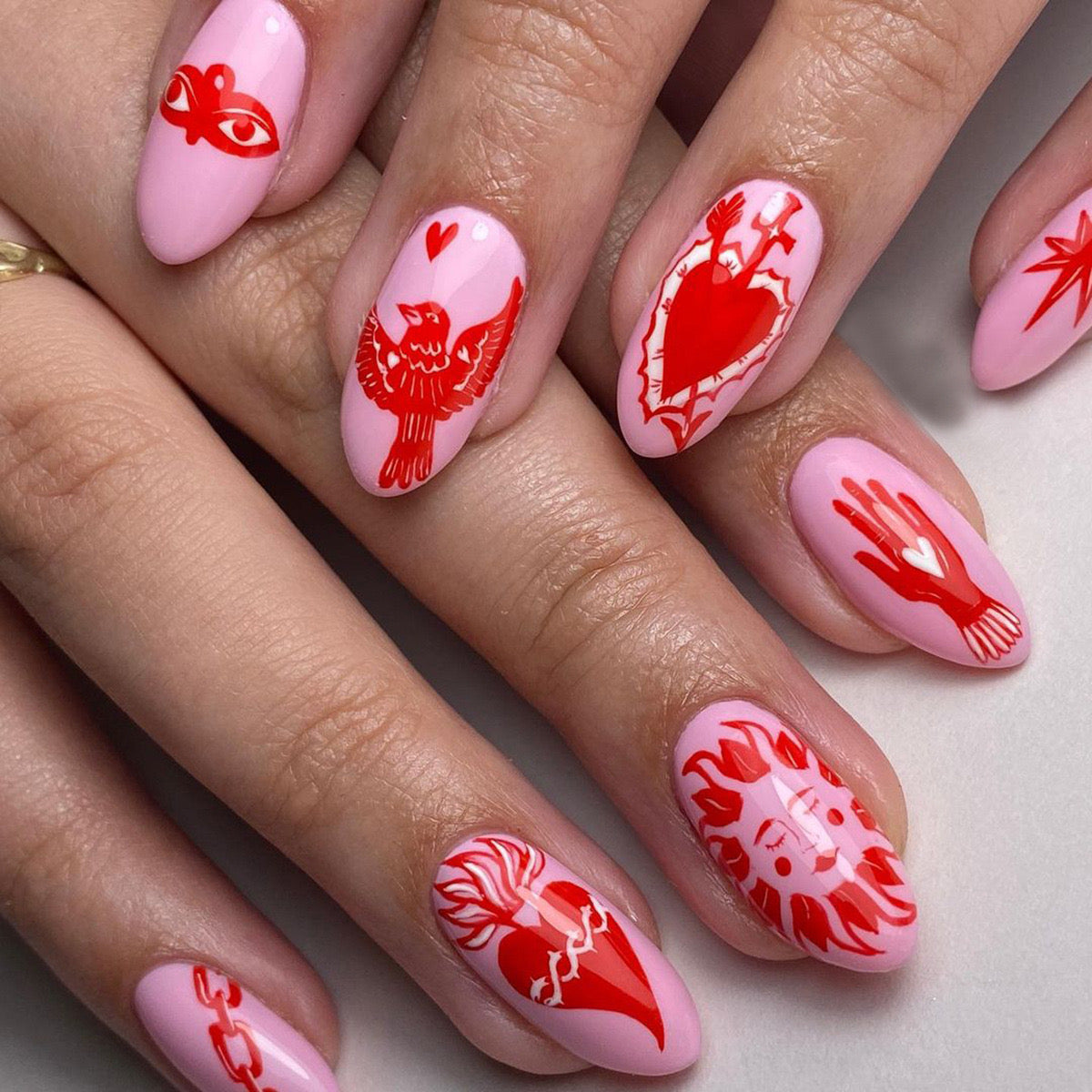 Whimsical Love Medium Almond Soft Pink Press-On Nails with Bold Red Love-Inspired Artwork