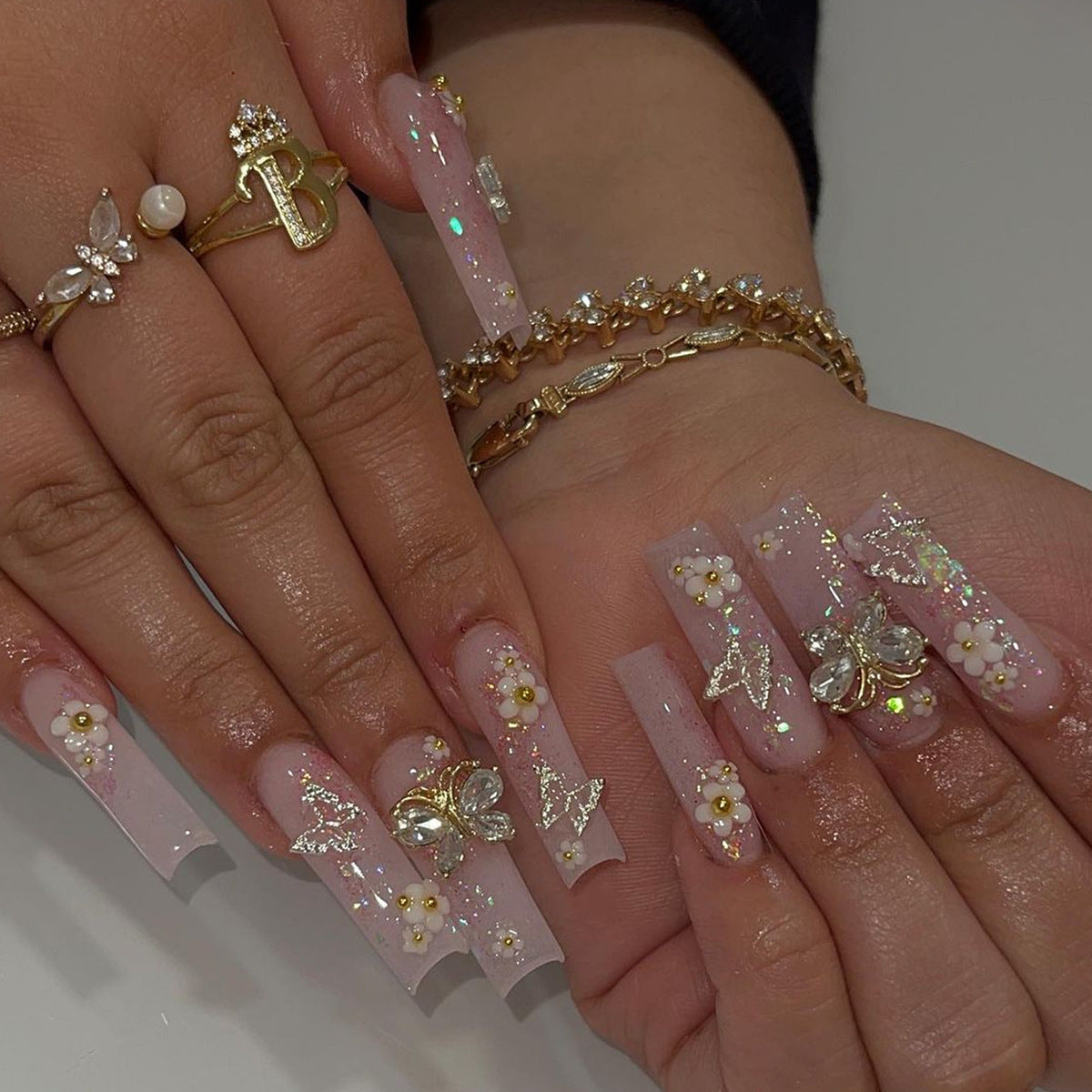 Enchanted Garden Long Coffin Sheer Pink Press-On Nail Set with Gold Flakes, Floral Accents, and Rhinestone Embellishments