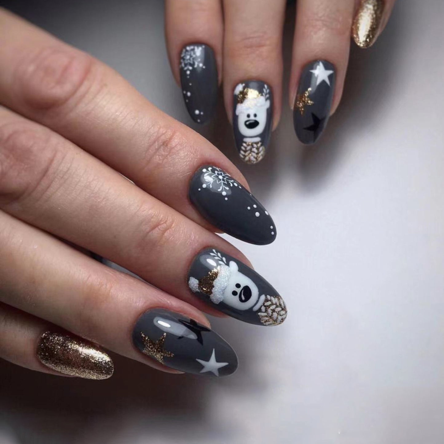 Winter Magic Medium Almond Press On Nails in Charcoal with Glitter Accents and Snowflake Design