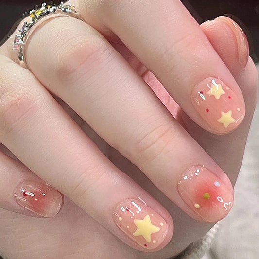 Starry Charm Short Squoval Peach Press On Nails with Star Accents and Gradient Detail