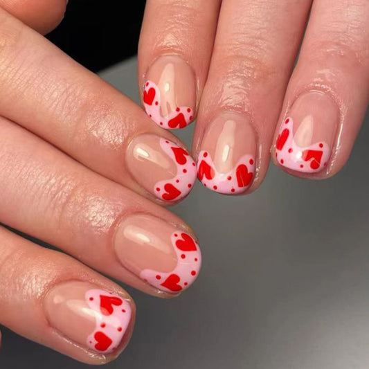 Romantic Affair Short Length Round Beige Press On Nails with Red Heart Accents