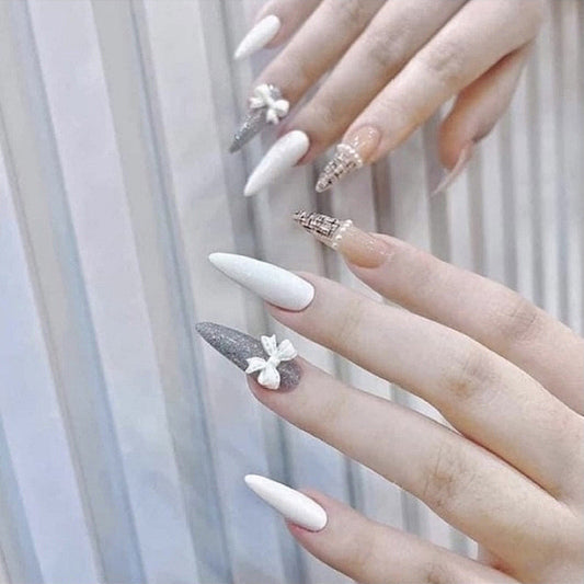 Chic Alabaster Stiletto Long Press-On Nails with Glitter Accents and Floral Embellishments