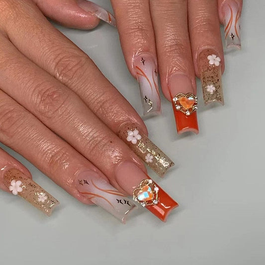 Sunset Bloom Extra Long Square Orange Ombre Press On Nail Set with Gold Glitter, Floral and Star Accents