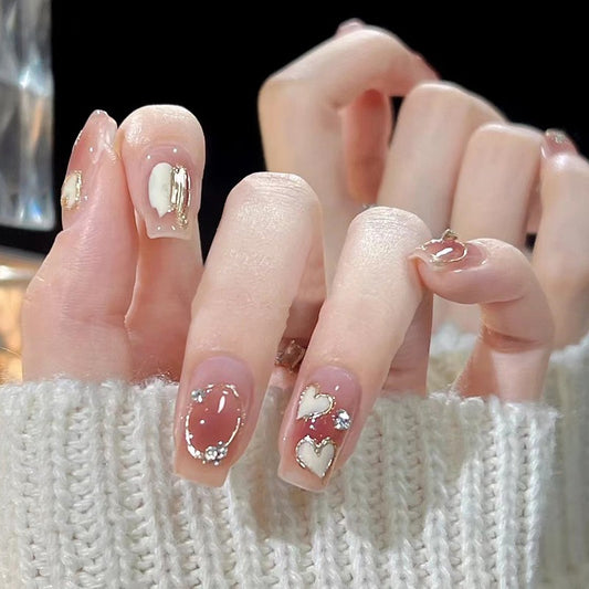 Winter Whisper Medium Square Press On Nail Set in Beige with Gold Foil Accents and Heart Gemstone Detailing