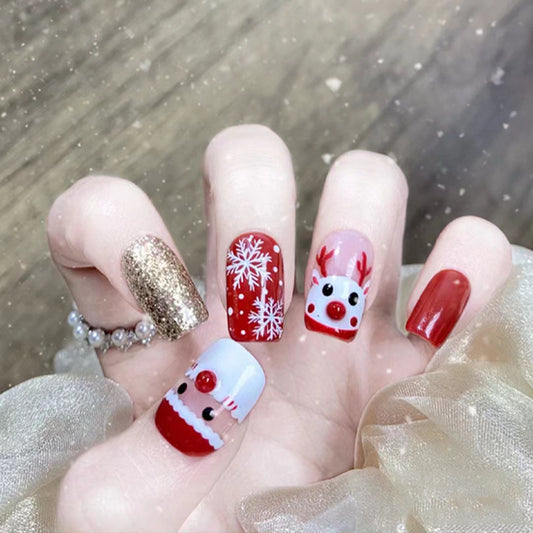 Winter Wonderland Medium-Length Square Press On Nail Set in Red, White and Gold with Festive Reindeer and Snowflake Designs