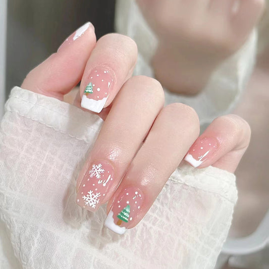 Winter Wonderland Medium Length Oval Pink Press On Nail Set with Festive Snowflake and Christmas Tree Design